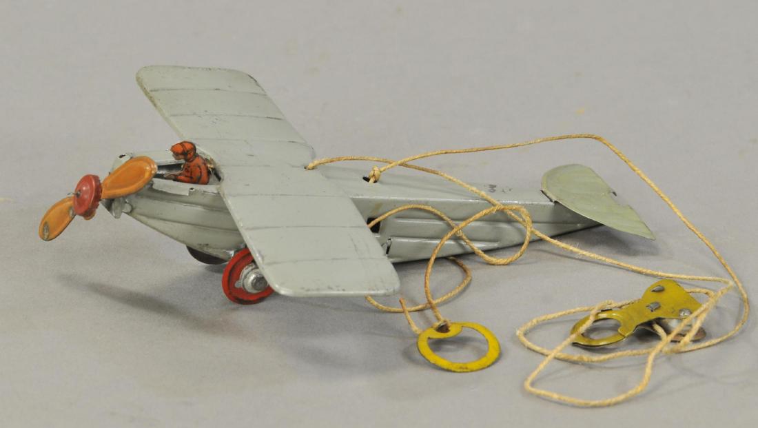 CIRCLING AIRPLANE PENNY TOY (1 of 3)