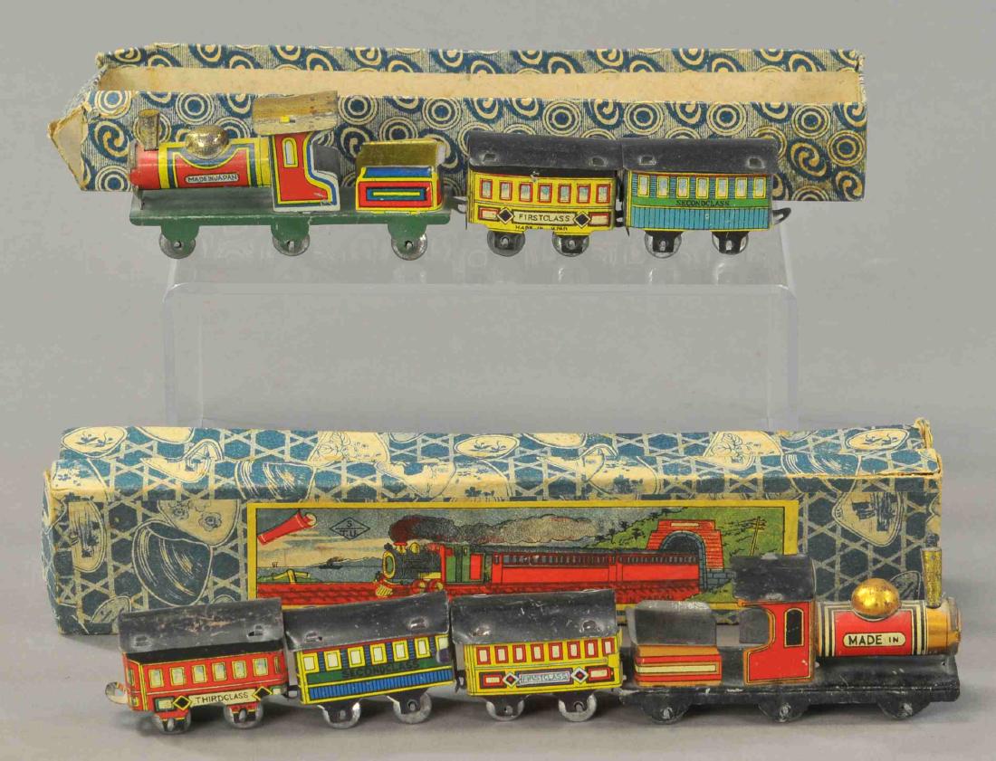 PAIR OF JAPANESE PENNY TOY TRAIN SETS