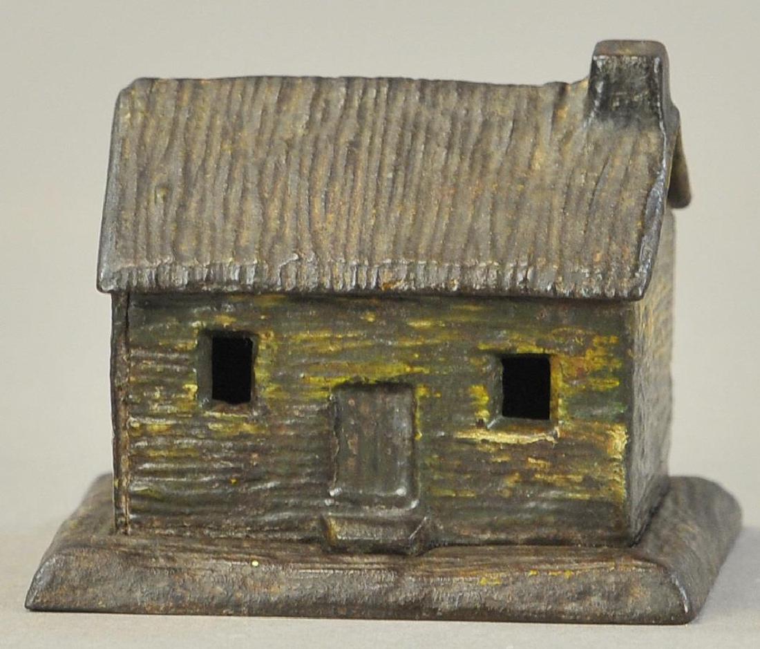KYSER & REX CABIN STILL BANK: 2305. KYSER & REX CABIN STILL BANK | 3.5" l.