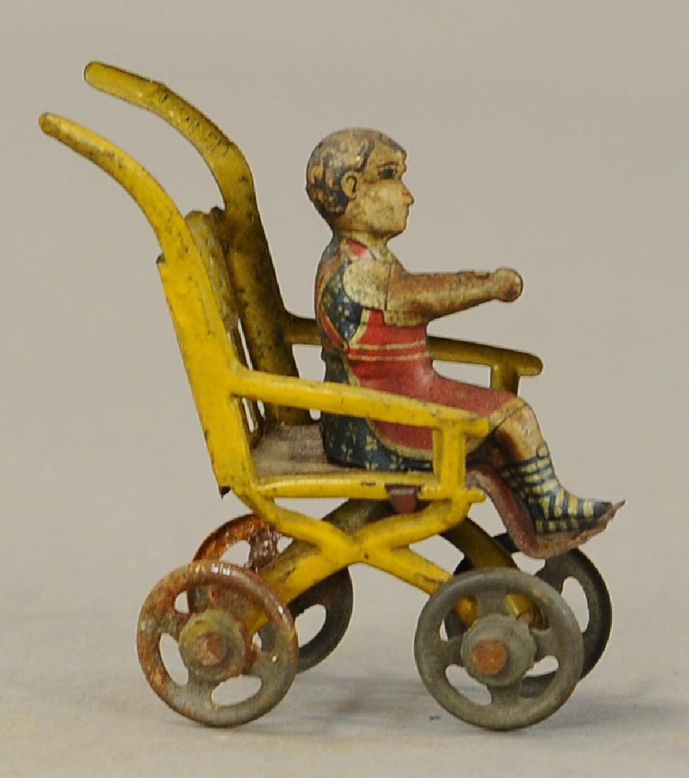 CHILD IN PUSH CHAIR PENNY TOY (1 of 3)