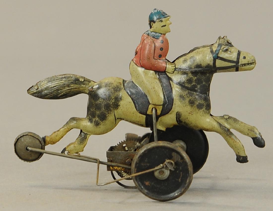 GERMAN JOCKEY ON HORSE WIND-UP TOY: 61. GERMAN JOCKEY ON HORSE WIND-UP TOY | 5" l.