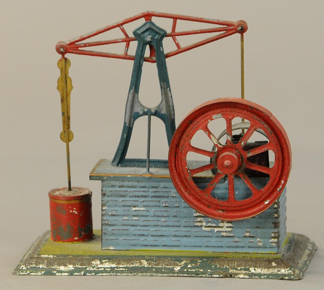 GERMAN TIN CLOCKWORK WATER PUMP (1 of 3)