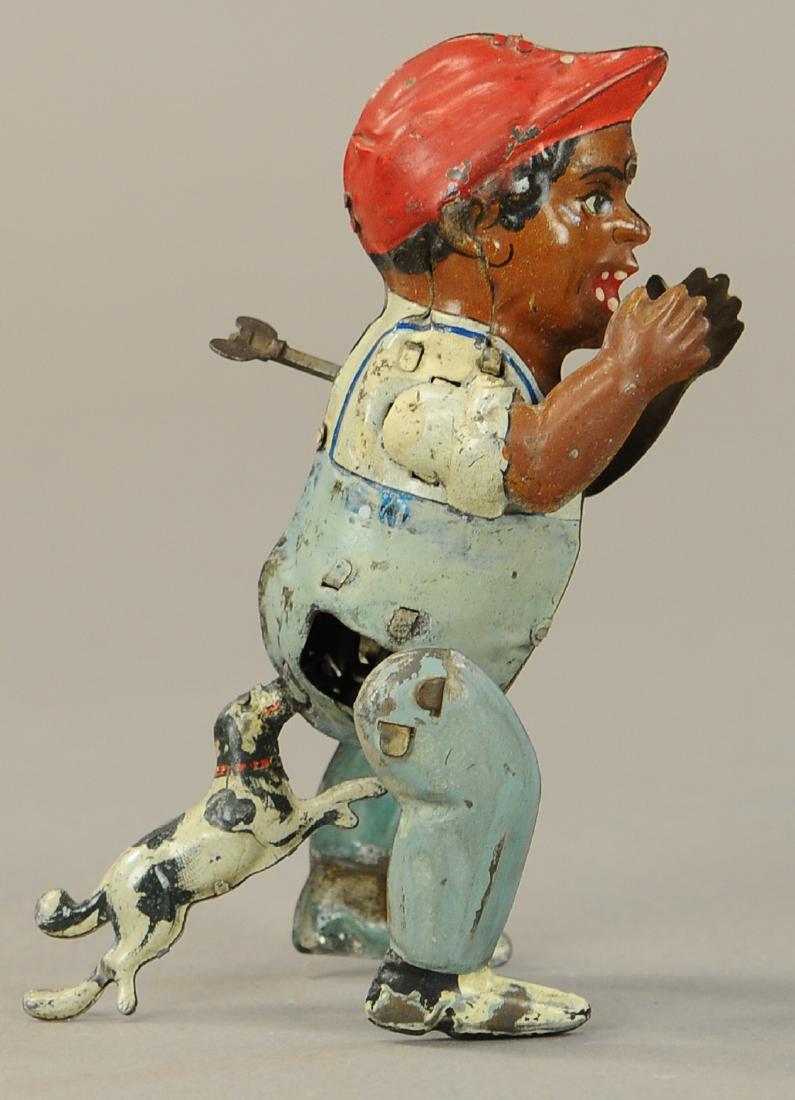 DOG CHASING BOY CLOCKWORK TOY (1 of 3)