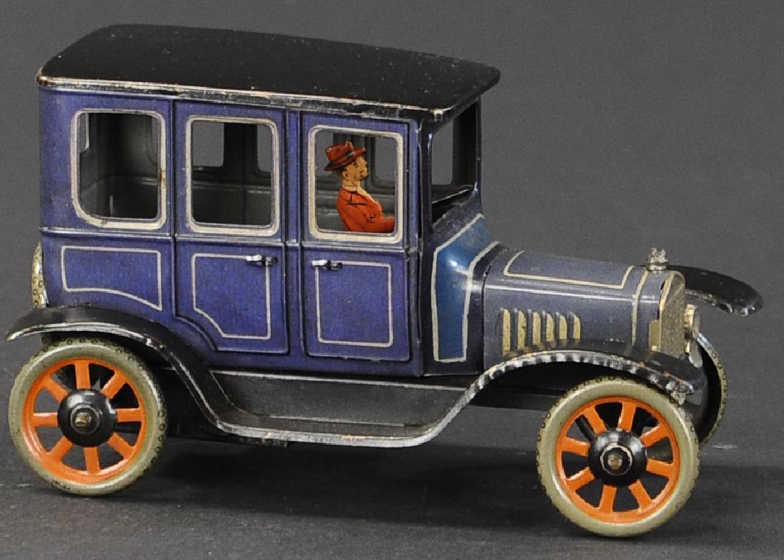 BING MODEL T SEDAN: 426. BING MODEL T SEDAN | Wind-up car, Germany, c. 1920s, done in blue body, black roof, spoke wheels colored in orange spokes, | 6.5" l.
