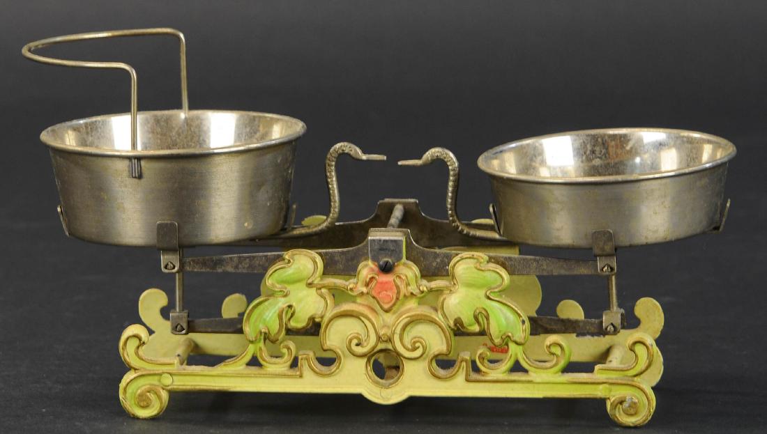 LARGE MARKLIN CAST IRON SCALE: 480. LARGE MARKLIN CAST IRON SCALE | Cast iron scale with elaborate casting, hand painted floral design, weight indicators are two birds whose beaks become level with one another when weight is equal.