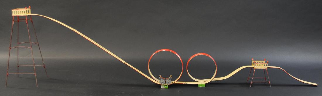 DOUBLE LOOP THE LOOP COASTER: 515. DOUBLE LOOP THE LOOP COASTER | Germany, attributed to Muller & Kadeder, hand painted early loop toy | 55" l.