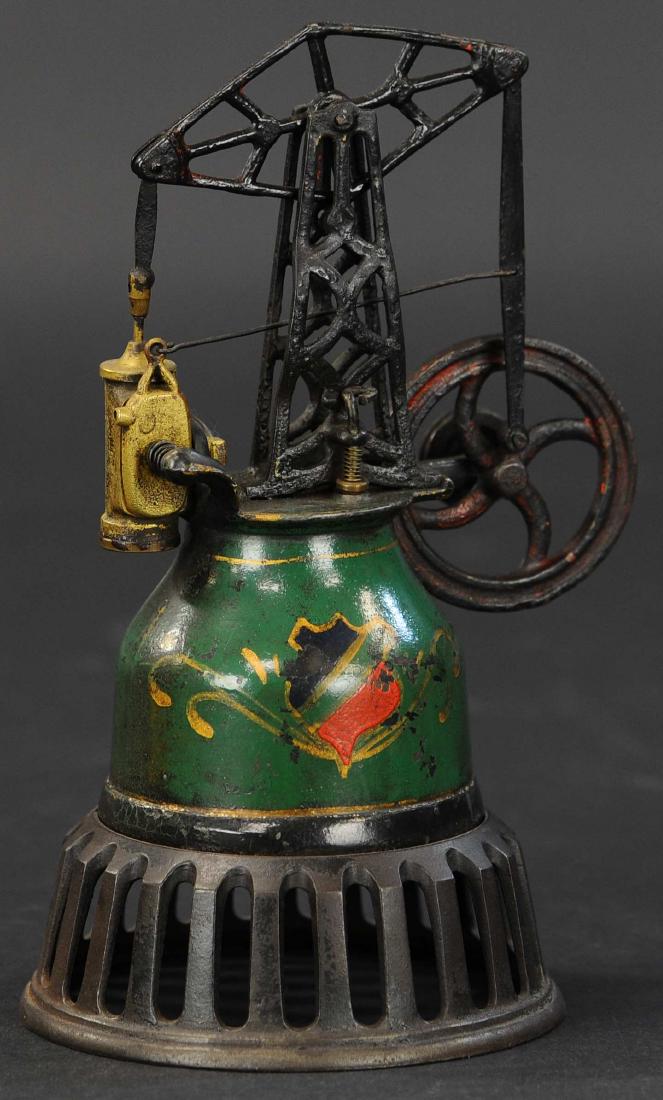 FRISBEE BEAM STEAM ENGINE: 569. FRISBEE BEAM STEAM ENGINE | Cast iron base and boiler, piston moves one end of beam up and down which in turn drives flywheel for powering accessories. | 8" h.