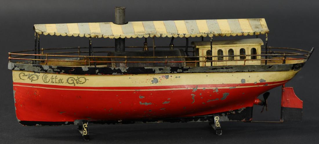 SCHOENNER LIVE STEAM RIVERBOAT: 592. SCHOENNER LIVE STEAM RIVERBOAT | c. 1900, live steam riverboat, features hand painted hull with lithographed tin canopy, pilots house on stern, great early river steamer in colorful design. Ex. M
