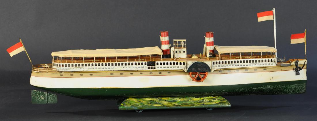 MARKLIN RHEINGOLD PADDLE WHEEL RIVERBOAT: 770. MARKLIN RHEINGOLD PADDLE WHEEL RIVERBOAT | Long clockwork boat with sleek hull designed to comfortably and quietly cruise through fresh water, driven by a paddlewheel on each side that actually p