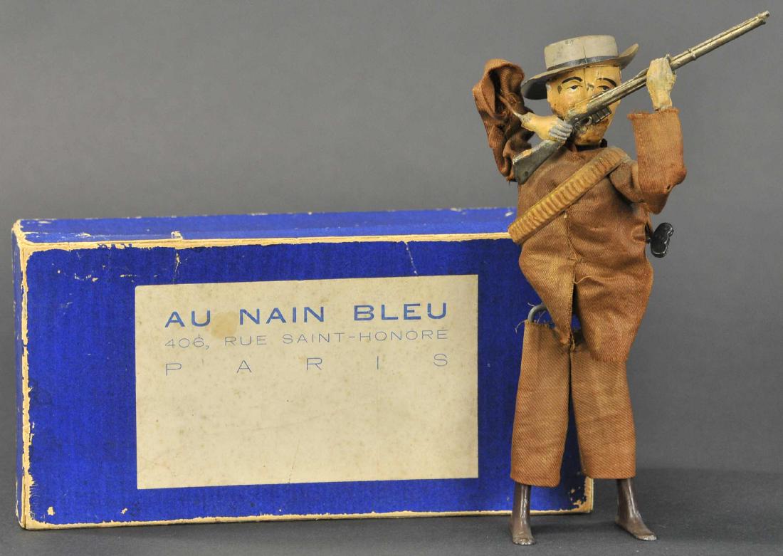 BOXED MARTIN VALIANT BOER: 12. BOXED MARTIN VALIANT BOER | c. 1900, France, tin litho figure dressed in cloth jacket and pants, bullet band across chest and carrying rifle, clockwork activated swaying motion as if the soldier i