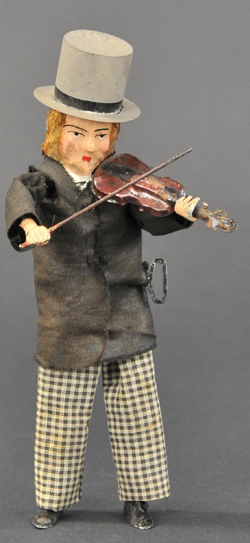 MARTIN MERRY VIOLINIST: 19. MARTIN MERRY VIOLINIST | Vintage French 1897,"Le Gai Violiniste", clockwork mechanism, one of the most desirable Martin pieces, this tin plate figure with painted features holds a metal violin and