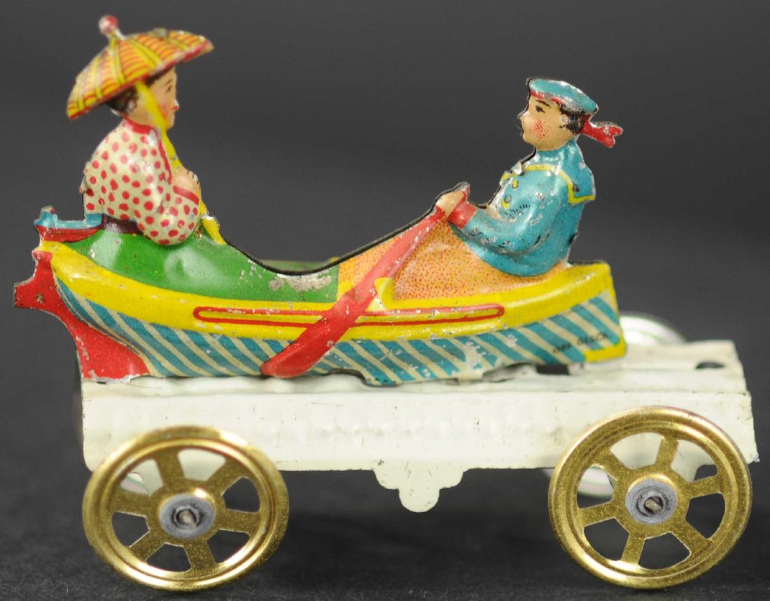 MEIER BOY AND GIRL IN ROWBOAT PENNY TOY: 58. MEIER BOY AND GIRL IN ROWBOAT PENNY TOY