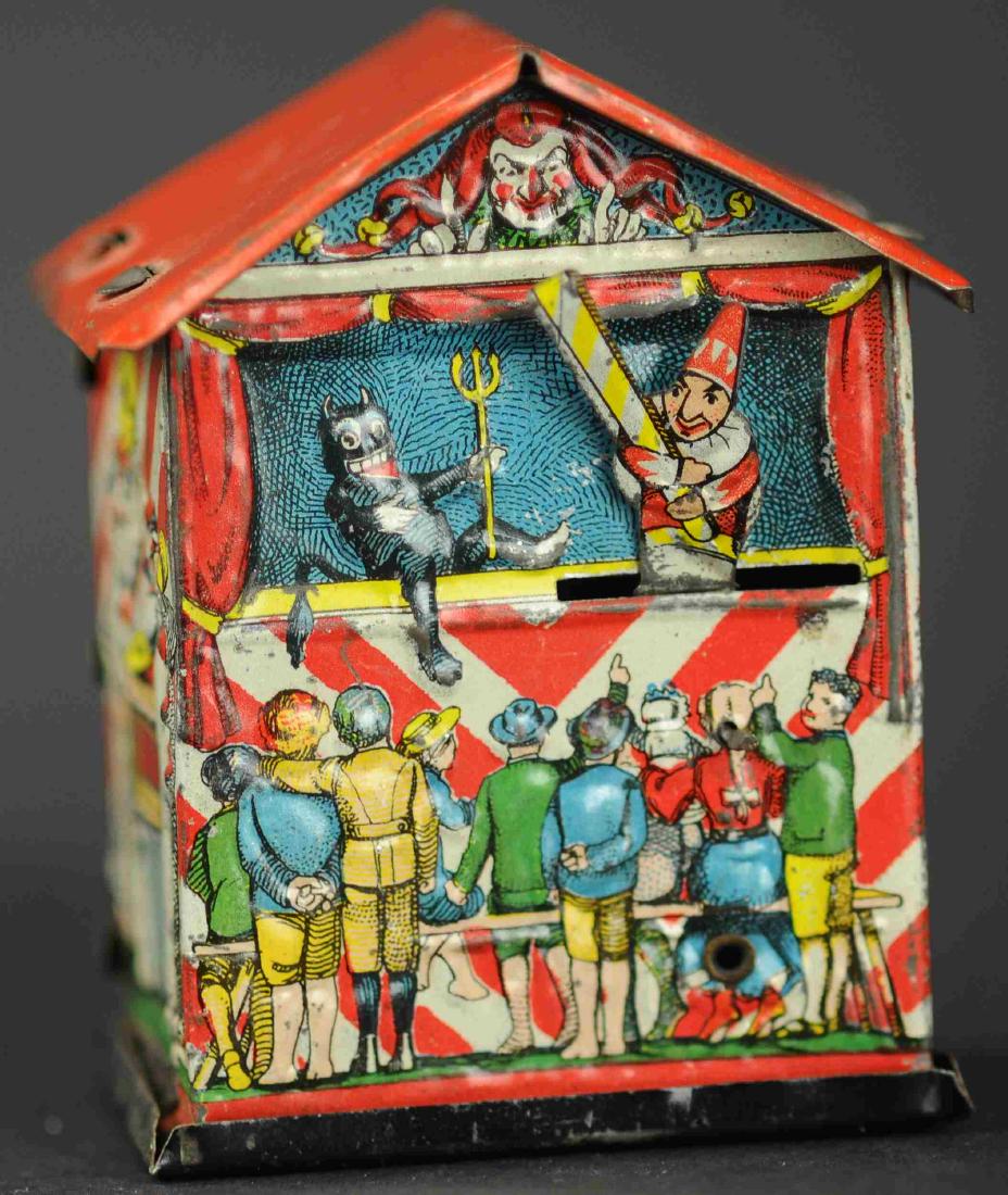 GERMAN PUPPET THEATER BANK PENNY TOY: 91. GERMAN PUPPET THEATER BANK PENNY TOY | One of few articulated money boxes with a crank at rear which causes punch figure to club at the devil.