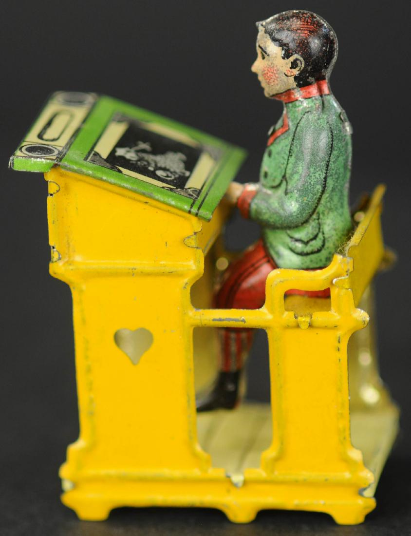 MEIER BOY AT SCHOOL DESK PENNY TOY: 165. MEIER BOY AT SCHOOL DESK PENNY TOY | Identical to the girl version, however the boys desk has imagery of an oriental figure in lieu of mathematics