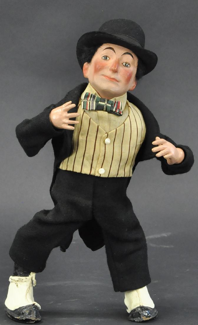 ROULLET AND DECAMPS MECHANICAL WALKING/TODDLING MA: 204. ROULLET AND DECAMPS MECHANICAL WALKING/TODDLING MA | Rarely found mechanical with "all Nain Bleu" paper label on sole of foot, papier mache head and composition hands in full suit, top hat and sp