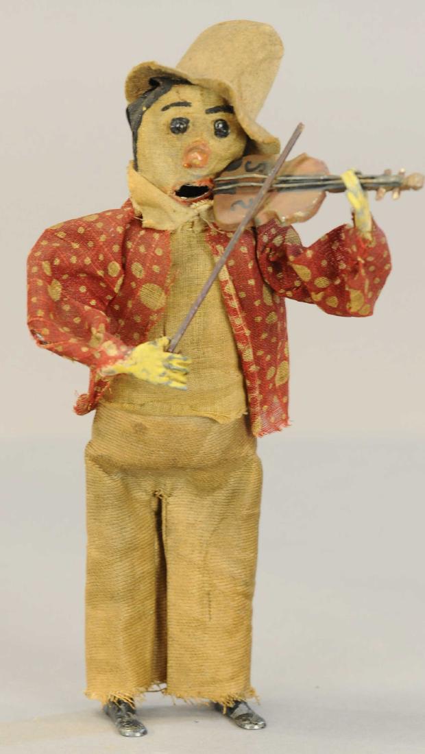 CLOTH FACED CLOWN WITH VIOLIN: 37. CLOTH FACED CLOWN WITH VIOLIN | The maker is unknown although a few collectors have suggested it might be a Martin prototype. 8" h. | Appears to be in All Original Condition. | $400 - $800