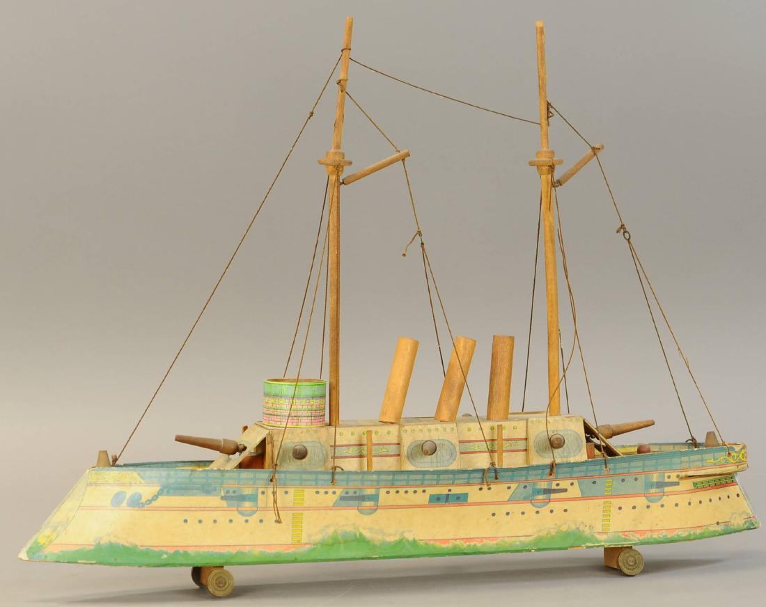 BLISS BATTLESHIP COLUMBIA: 181. BLISS BATTLESHIP COLUMBIA | 26" l. | Tape repair at bow, missing five wooden searchlights. | $150 - $300