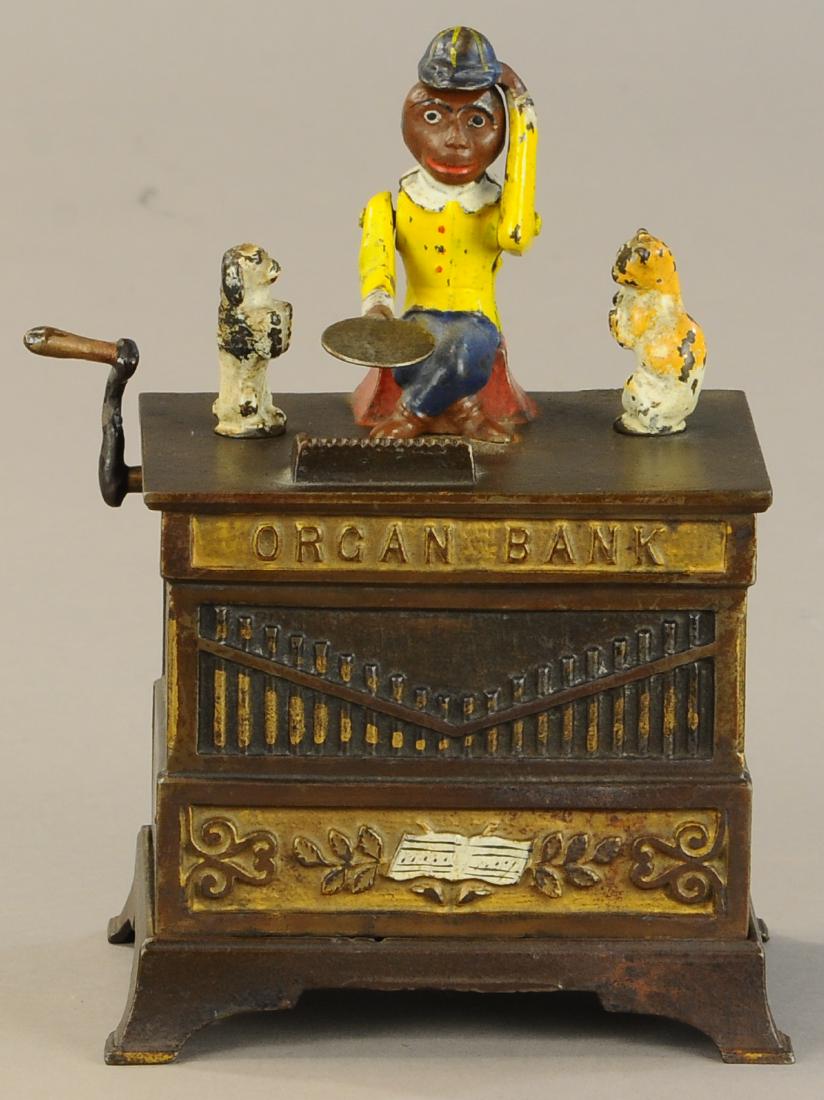 ORGAN BANK W/ DOG AND CAT MECHANICAL BANK: 218. ORGAN BANK W/ DOG AND CAT MECHANICAL BANK | Crank is repaired, otherwise paint in All Original Condition. | $300 - $600
