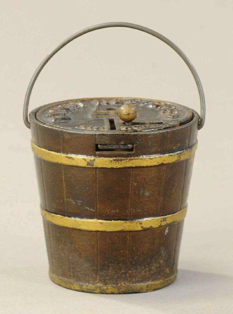 PENNY REGISTER PAIL STILL BANK: 250. PENNY REGISTER PAIL STILL BANK | Kyser & Rex. | 3" h. | (VG-Exc. Cond.) | $200 - $300