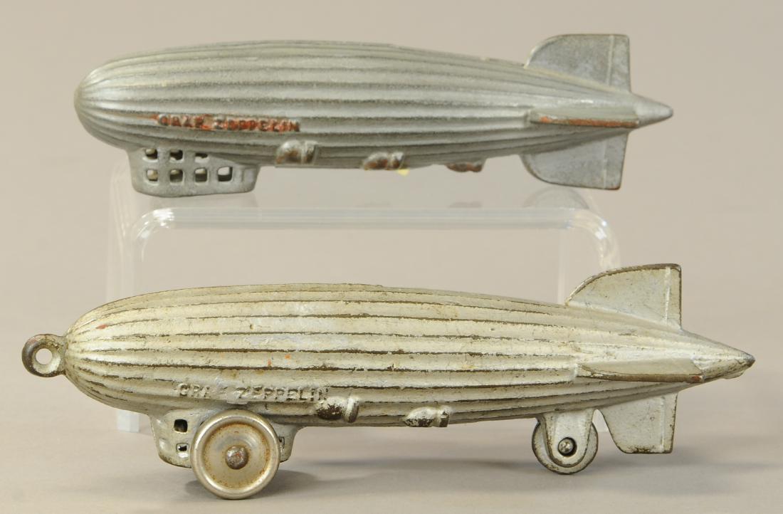 PAIR OF GRAF ZEPPELIN STILL BANKS: 286. PAIR OF GRAF ZEPPELIN STILL BANKS | A. C. Williams, large Zeppelin, rare pull toy example with wheels. | 6.5" - 8" l. | (Exc. Cond.) | $250 - $450