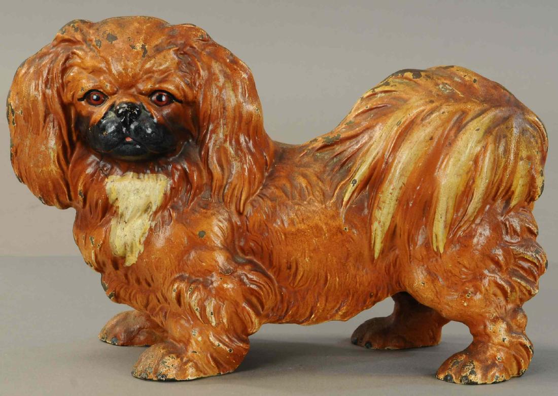 PEKINGNESE DOG DOORSTOP: 392. PEKINGNESE DOG DOORSTOP | Hubley, Cat#454, one of the largest dog doorstops made by Hubley, incredibly lifelike casting. | 9.75"h. | (Exc - Pristine Cond.) | $800 - $1,200