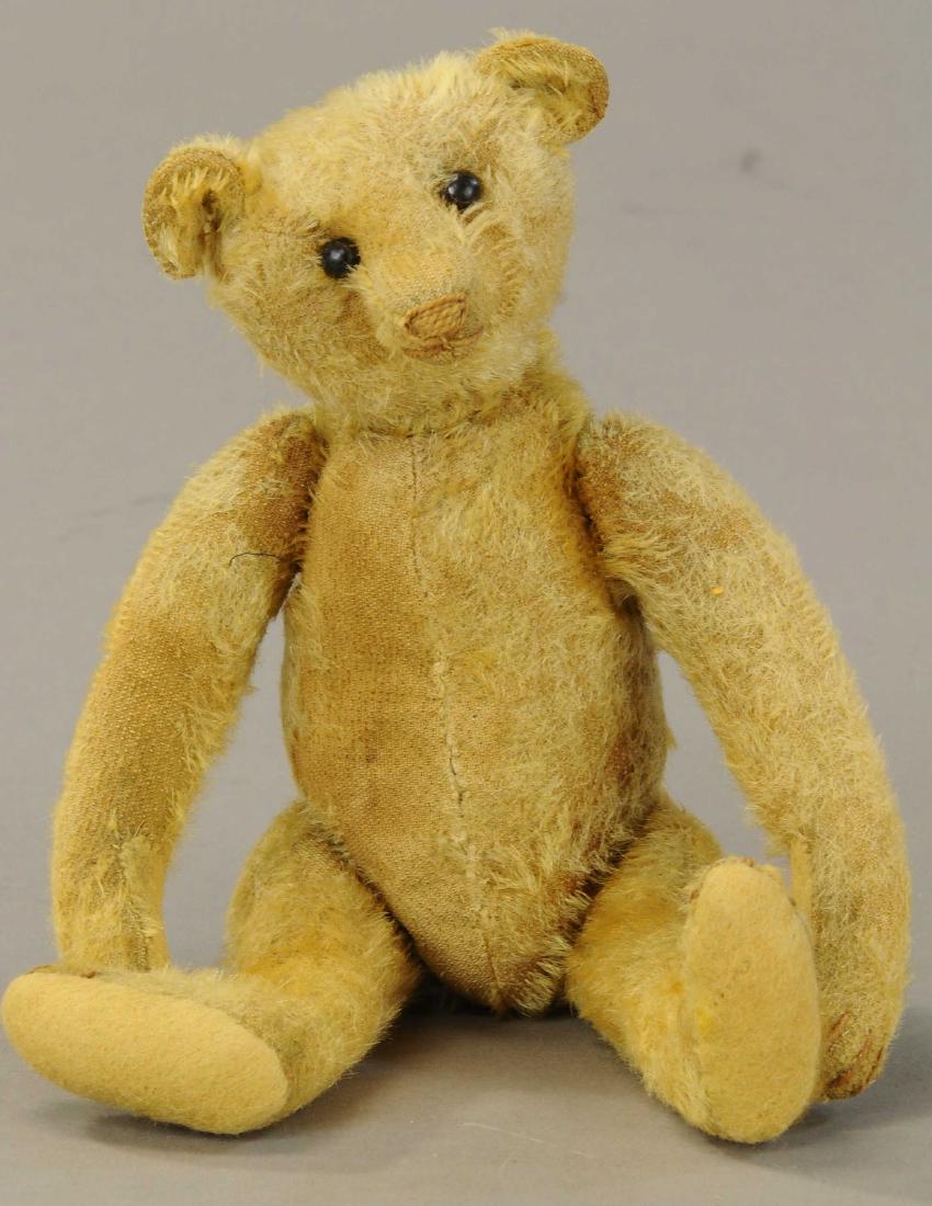 10" STEIFF BLOND BEAR: 469. 10" STEIFF BLOND BEAR | Shoe button eyes, brown stitched nose, original pads, pleasing face and confirmation. | Hair loss throughout, some repairs on hands. (Good Condition) | $300 - $500
