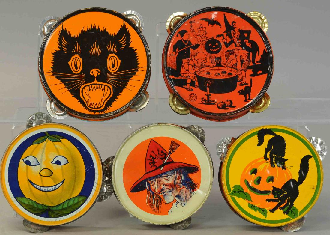 GROUPING OF FIVE TIN TAMBOURINES: 533. GROUPING OF FIVE TIN TAMBOURINES | Black cats, witches and party children. | 6"-7" dia. | Some denting. (Very Good Condition) | $200 - $300