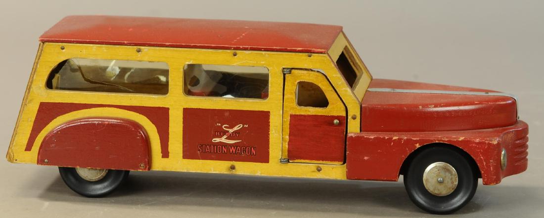 BUDDY L WOODIE STATION WAGON: 650. BUDDY L WOODIE STATION WAGON | 18" l. | Passenger side door is replaced, back window broken, otherwise in (Exc. Cond.) | $250 - $350