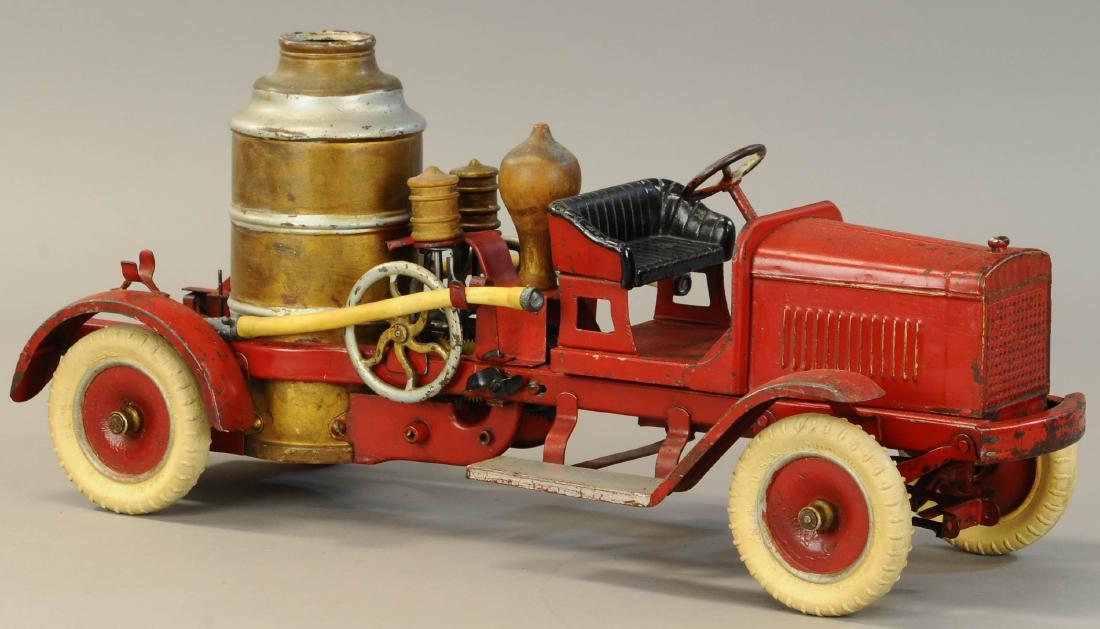 KINGSBURY FIRE PUMPER TRUCK: 693. KINGSBURY FIRE PUMPER TRUCK | Desirable example includes original pull handle. | 23" l. | One rear hose support replaced, very minor enhancement to wheel hubs and a small spot on driver side fron