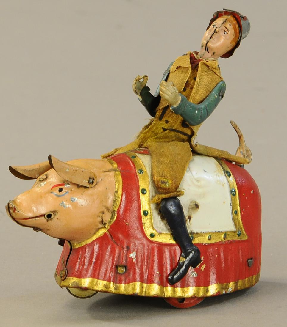 LEHMANN PADDY AND THE PIG: 1048. LEHMANN PADDY AND THE PIG | Familiar theme with an Irishman taking the reigns of a blanketed pig. | 6" l. | (Exc. Cond.) | $700 - $1,000