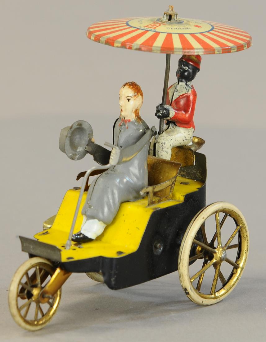 LEHMANN NEW CENTURY CYCLE: 1087. LEHMANN NEW CENTURY CYCLE | Top hat in hand version with striped umbrella pattern. | 5" h. | Tiller replaced, otherwise in (Exc. - Pristine Cond,) | $300 - $500