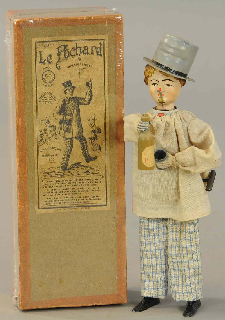 BOXED FERNAND MARTIN DRUNKARD: 1097. BOXED FERNAND MARTIN DRUNKARD | 8" h. | Face has minor scratching from cup, otherwise in overall (Pristine - Near Mint Cond.) | $1,000 - $1,400