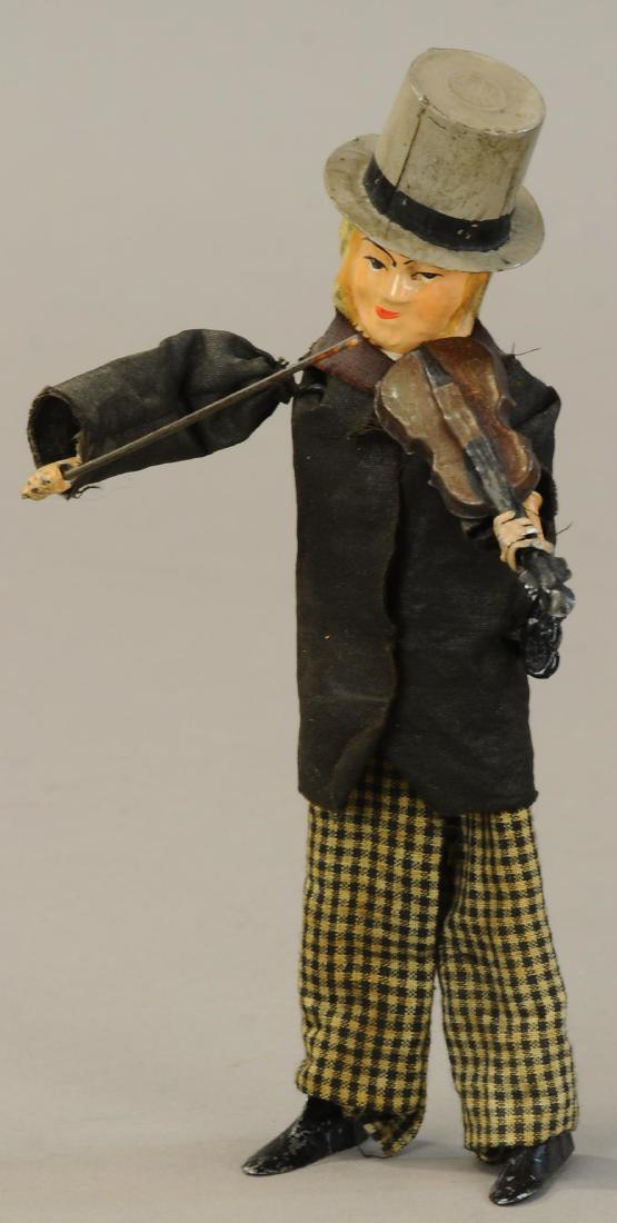 FERNAND MARTIN VIOLINIST: 1098. FERNAND MARTIN VIOLINIST | Hand painted tin head, face, violin, and hat, clockwork activated violinist moves his bow across the strings of the violin as he moves side to side. | 8" l. | (Pristin