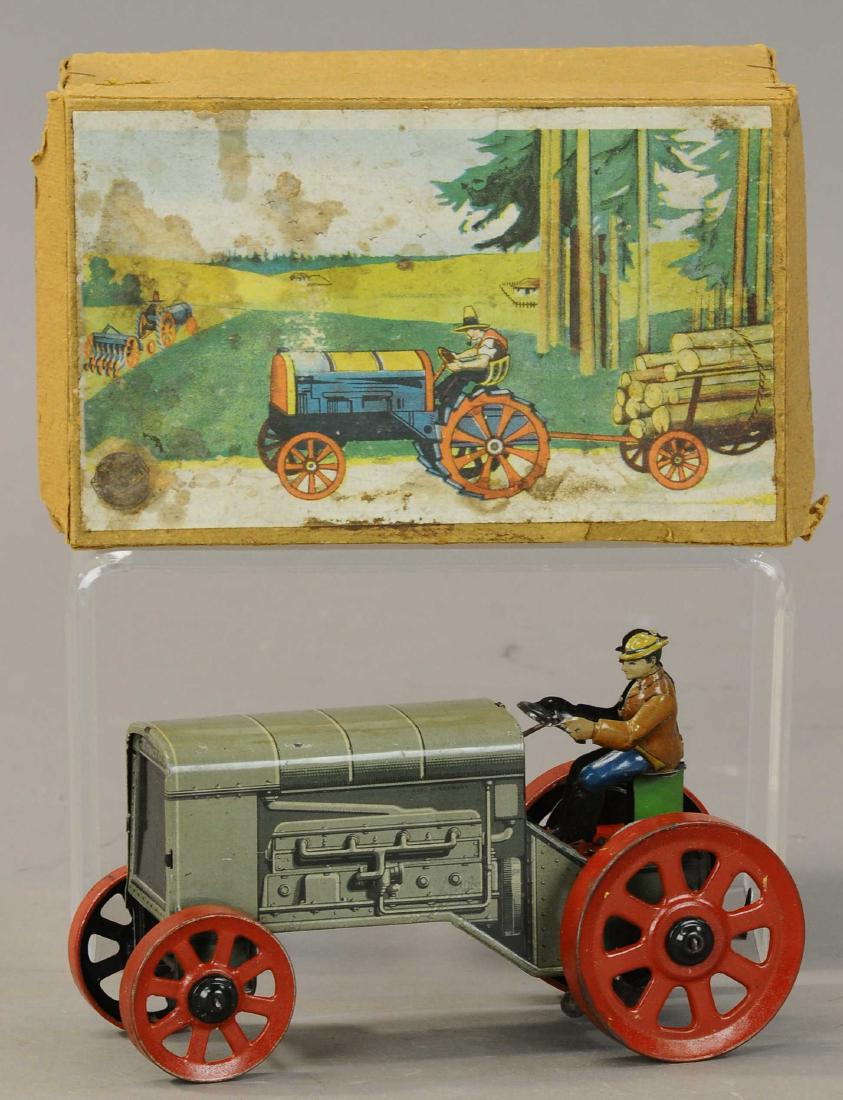 BOXED LARGE DISTLER WIND-UP TRACTOR: 1135. BOXED LARGE DISTLER WIND-UP TRACTOR | Larger scale but similar in design to the familiar penny toy version. | 7" | (Pristine Cond.) | $300 - $500