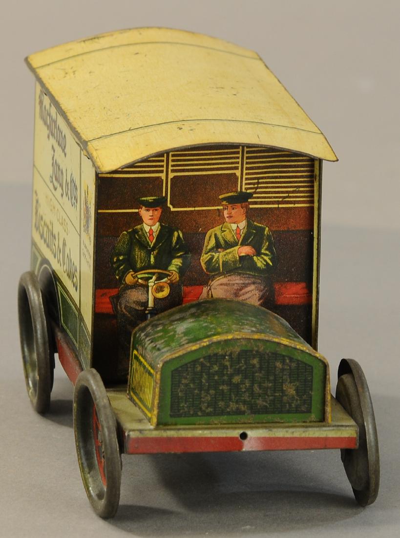 MACFARLANE LANG & CO. DELIVERY VAN BISCUIT TIN: 1195. MACFARLANE LANG & CO. DELIVERY VAN BISCUIT TIN | circa. 1911, scarce example with exceptional graphic image of seated driver and assistant, extensive advertising on all sides. | 8" l. | (Exc. Co
