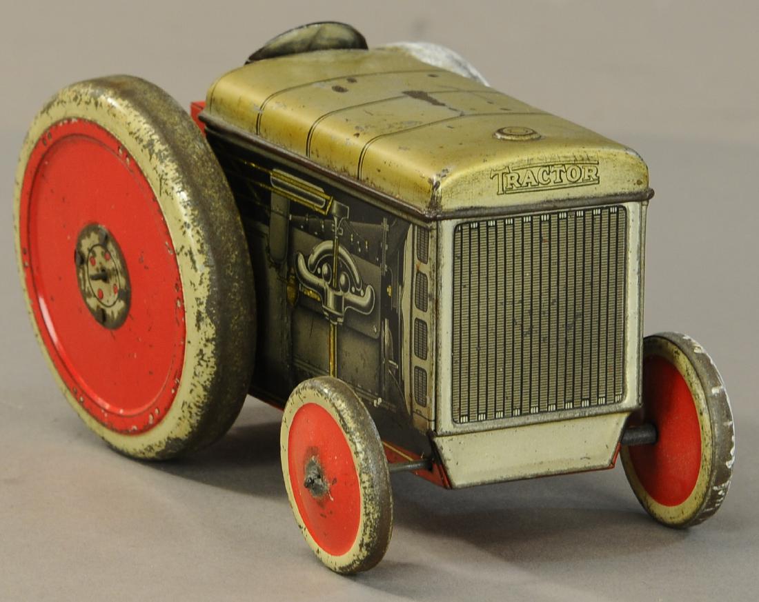 CRAWFORD & SONS TRACTOR BISCUIT TIN: 1204. CRAWFORD & SONS TRACTOR BISCUIT TIN | Company information appears at rear, hood lifts for biscuit storage. | 7" l. | (VG Cond.) | $600 - $900