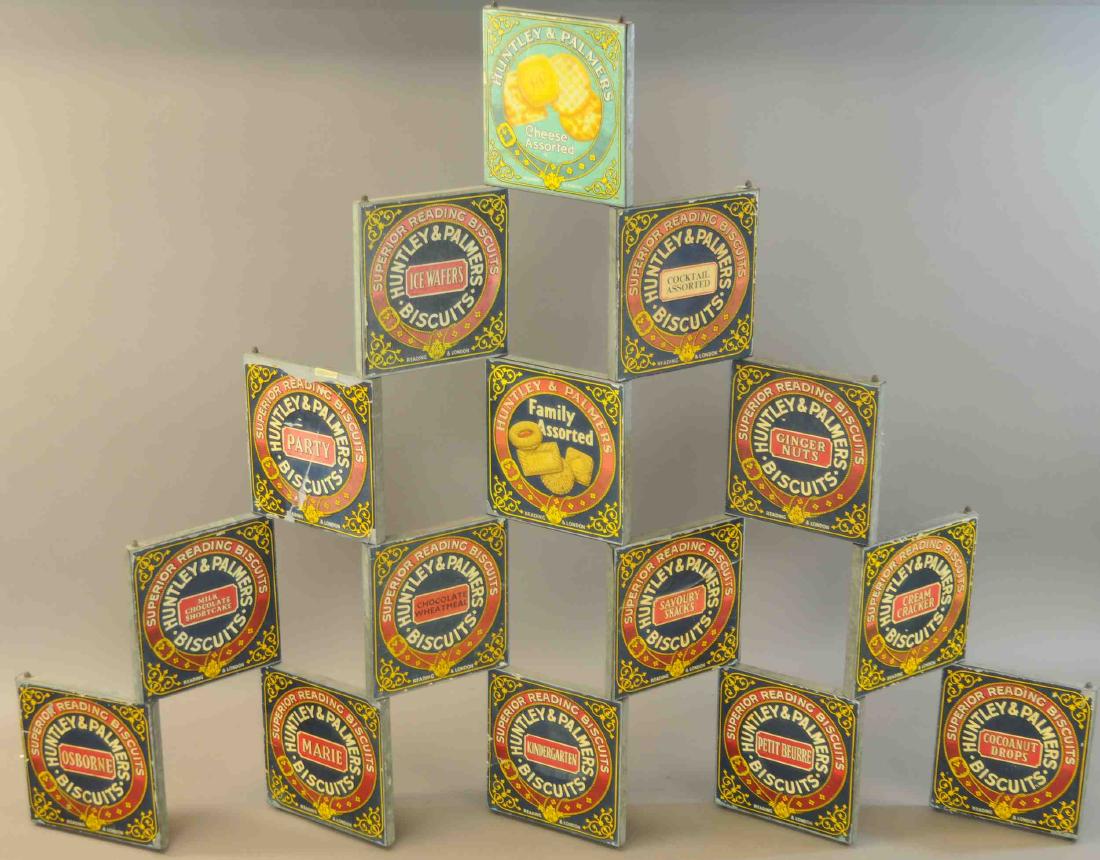 HUNTLEY PALMERS FIRE TIERED ADVERTISING SIGN: 1212. HUNTLEY PALMERS FIRE TIERED ADVERTISING SIGN | Hard to find, two-sided, multi-faced, paper litho on tin store display sign, colorful and descriptive, showing the many fine Huntley-Palmer biscuit