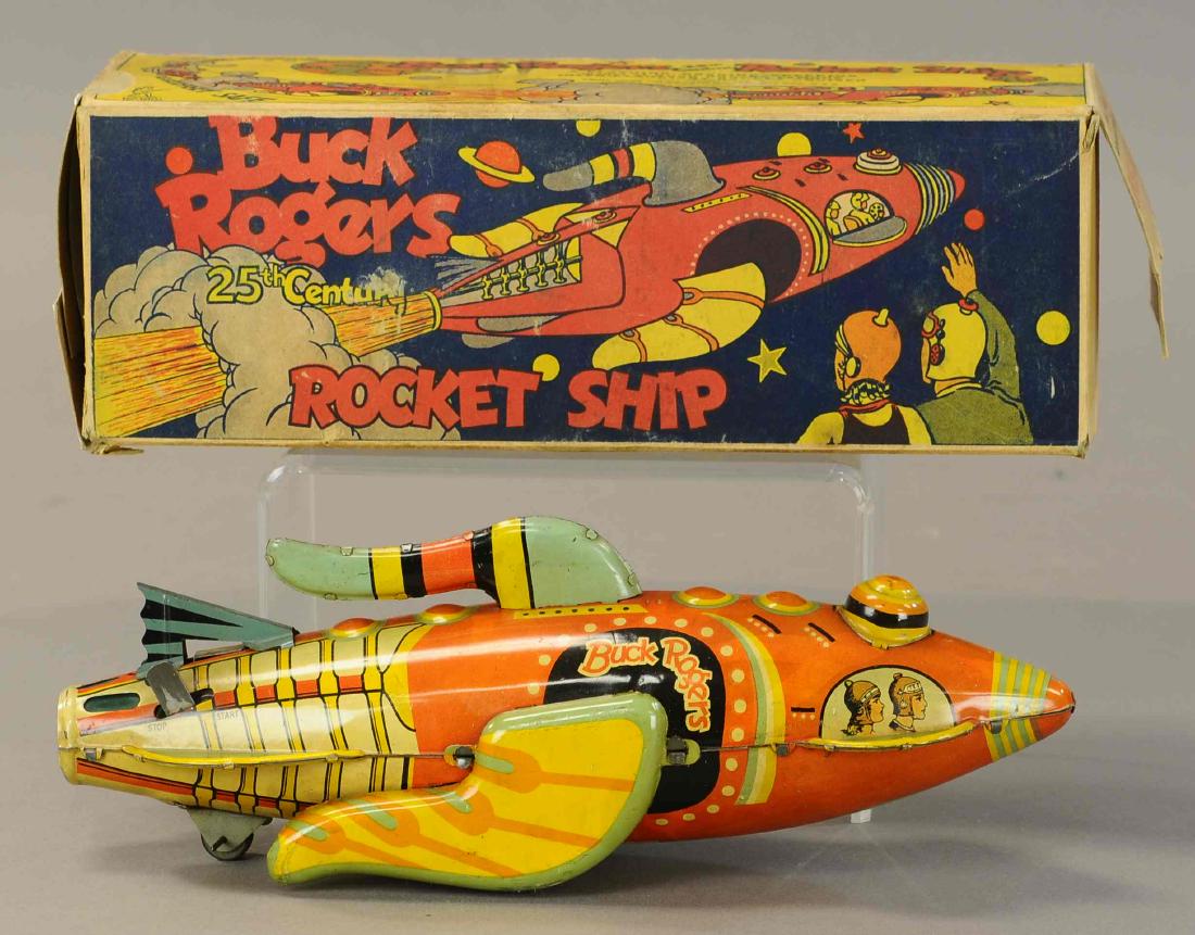 BOXED MARX BUCK ROGERS ROCKET CRUISER: 1216. BOXED MARX BUCK ROGERS ROCKET CRUISER | 12" l. | Box has two missing flaps and two replaced flaps, toy slightly faded otherwise in (Exc. - Pristine Cond.) | $400 - $600