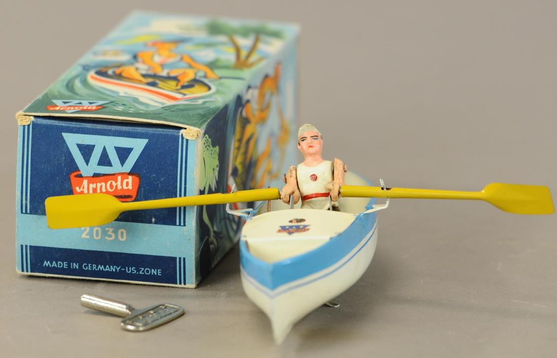 BOXED ARNOLD ROW BOAT: 1321. BOXED ARNOLD ROW BOAT | Nice realistic wind-up rowing motion. Provenance: Dick Claus Collection. | 8" l. | (Pristine - Near Mint Cond.) | $400 - $600