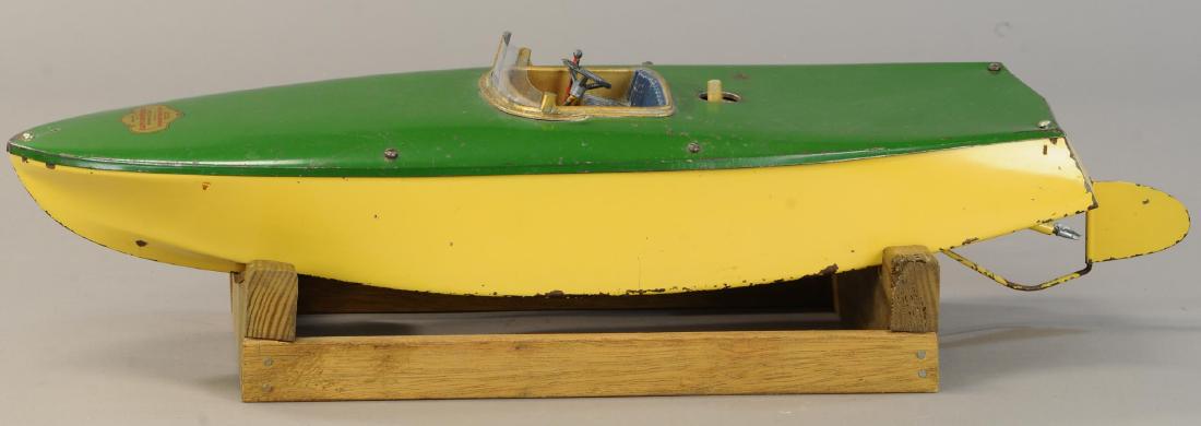 ORKIN CRAFT SPEEDBOAT: 1345. ORKIN CRAFT SPEEDBOAT | Wind-up motor. | 29" l. | Wind up mechanism is functioning however the key post has been customized, missing propeller, (VG Cond.) | $300 - $500
