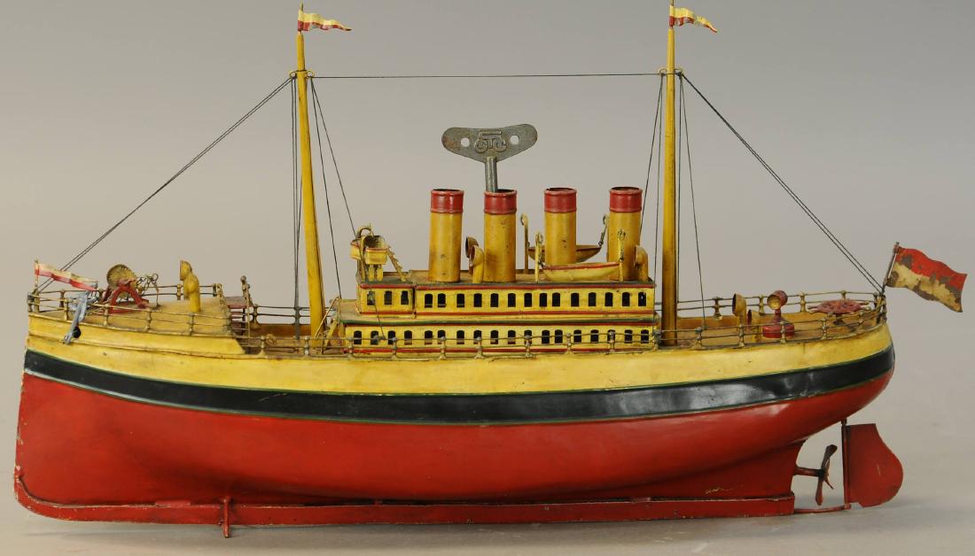 CARRETTE FOUR STACK OCEAN LINER: 1352. CARRETTE FOUR STACK OCEAN LINER | Wind-up motor functioning but could use lubrication. | 19" l. | Appears to be an original boat heavily varnished throughout. | $1,000 - $1,500