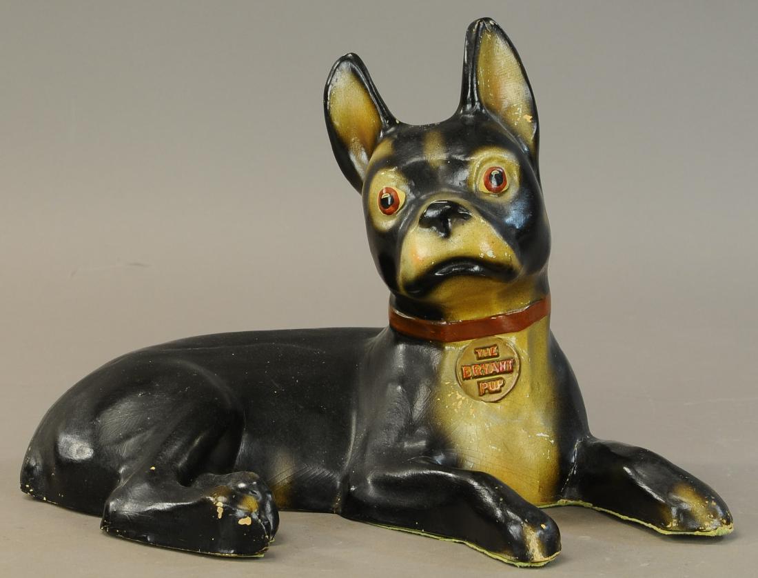 THE BRYANT PUP ADVERTISEMENT: 1486. THE BRYANT PUP ADVERTISEMENT | Advertising mascot for the Bryant Furnace Co., the watch dog of your heating system, papier mache w/collar tag marked, "The Bryant Pup." | 17" | (Exc. Cond.) | $30