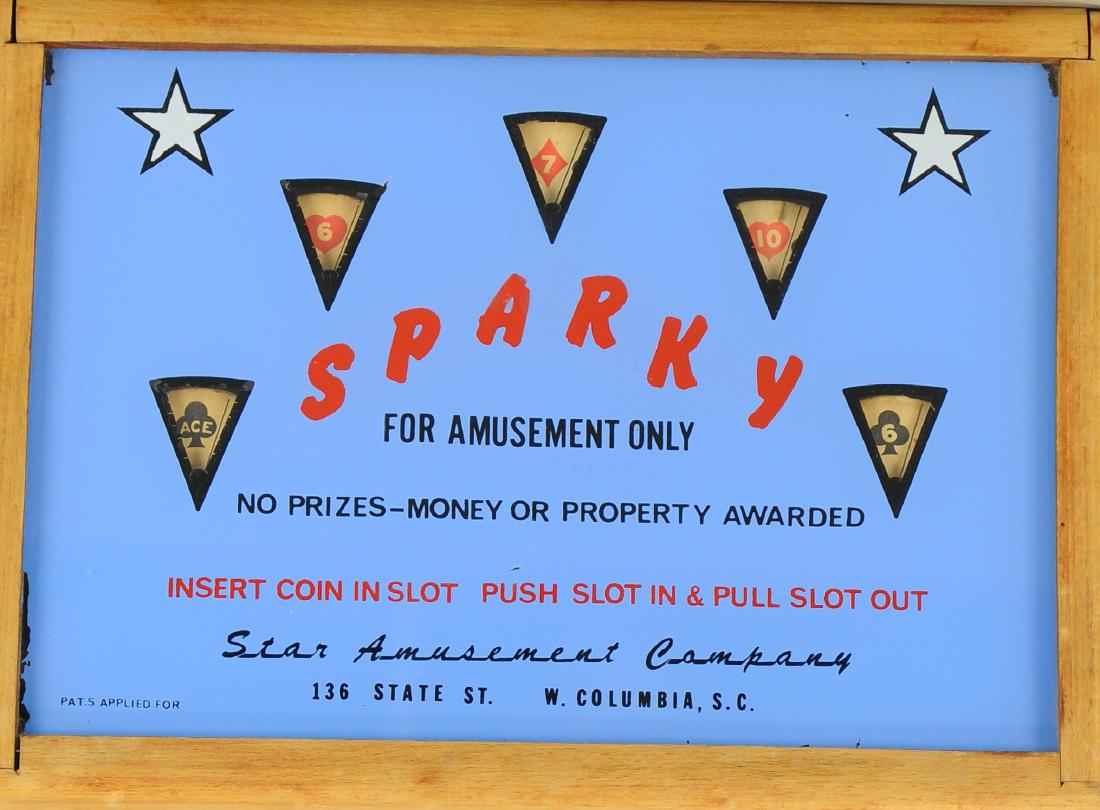 SPARKY COIN-OP MACHINE: 1490. SPARKY COIN-OP MACHINE | Sparky coin operated poker theme machine, table top model, needs some adjustment. | 15" w. | (Good to Very Good Condition) | $200 - $300