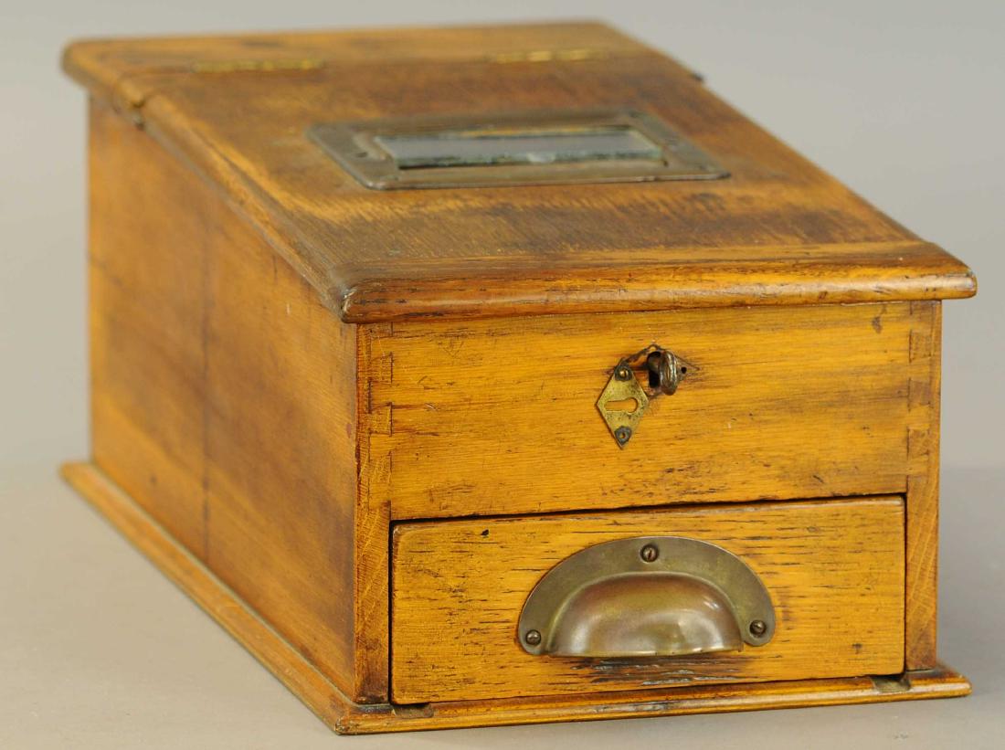 OLD WOODEN TRAVELING REGISTER: 1493. OLD WOODEN TRAVELING REGISTER | Pull out drawer dings bell and contains several positions for money and receipts, wheel inside glass door feeds receipt paper. | (VG - Exc. Cond.) | $200 - $400