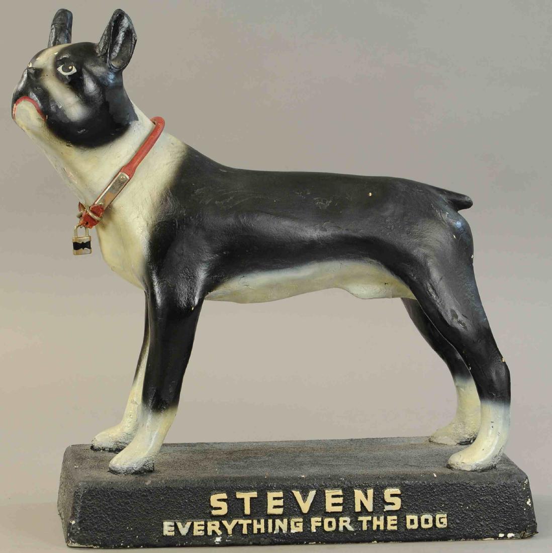 STEVENS EVERYTHING FOR THE DOG ADVERTISEMENT: 1501. STEVENS EVERYTHING FOR THE DOG ADVERTISEMENT | Composition bull dog on an advertising platform, a very hard example to find. | 20" h. | Repair to one back corner and a little in-painting, otherw