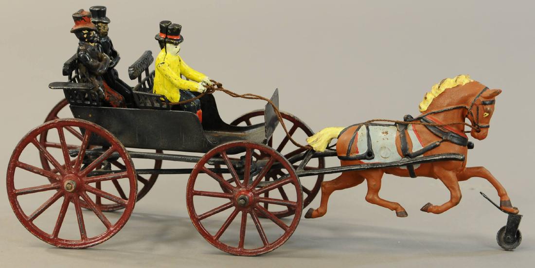 PRATT & LETCHWORTH LARGE SURREY: 1034. PRATT & LETCHWORTH LARGE SURREY | 15" l. | Driver figure and one passenger are replaced, one passenger figure is original, wheels and horse are repainted. | $200 - $400