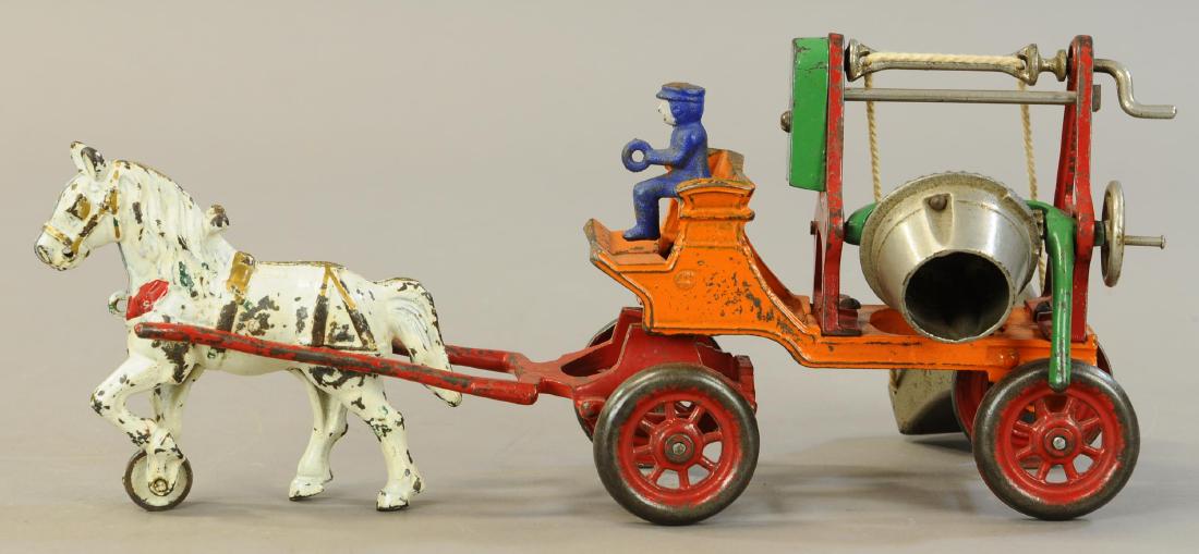 KENTON HORSE DRAWN CEMENT MIXER: 1068. KENTON HORSE DRAWN CEMENT MIXER | 15.5" l. | Horse and hitch are added/modified to match toy, was sold in a past auction and returned, now sold as-is. | $300 - $600