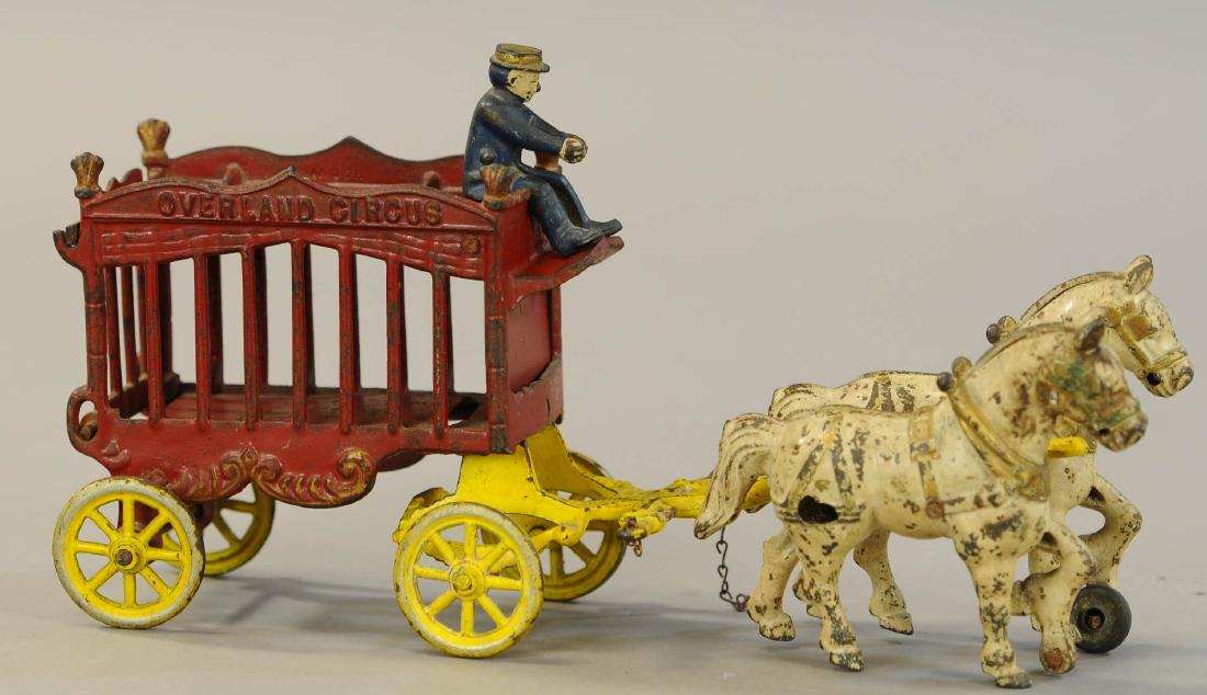 KENTON OVERLAND CIRCUS CAGE WAGON: 1077. KENTON OVERLAND CIRCUS CAGE WAGON | 14.5" l. | Missing one wheel under horse. | $50 - $100