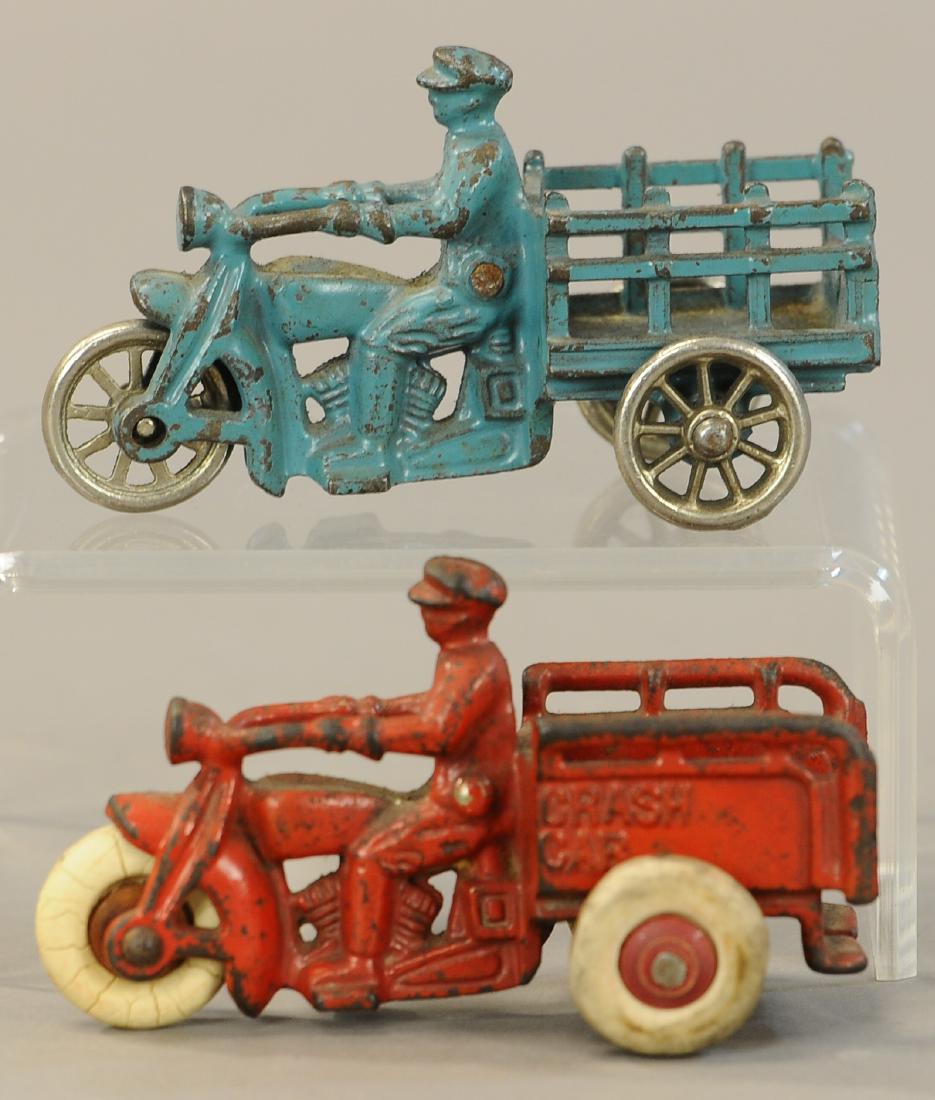 TWO HUBLEY DELIVERY MOTORCYCLES: 1102. TWO HUBLEY DELIVERY MOTORCYCLES | 5" l. | Red cycle has rear two tires replaced, otherwise both in All Original Condition. | $150 - $300