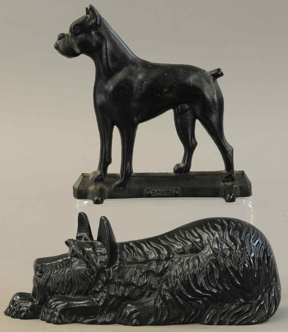 LAYING DOWN SCOTTIE & STANDING BOXER DOORSTOPS: 1163. LAYING DOWN SCOTTIE & STANDING BOXER DOORSTOPS | 11.5" l. | All Original Condition. | $100 - $200